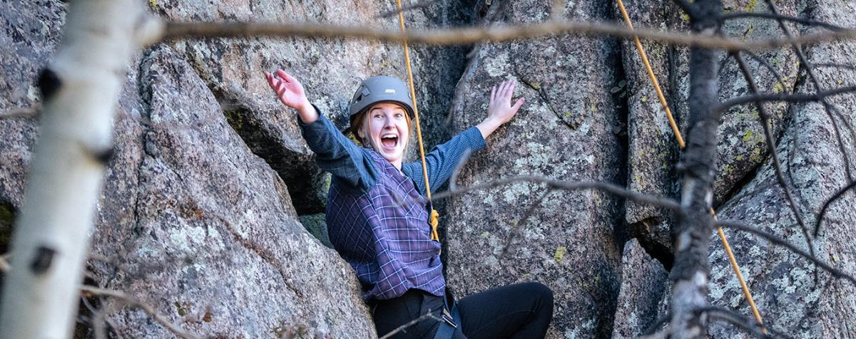 young woman climbing